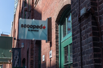 Obraz premium wall-mounted projecting sign outside Scooped by Demetres (Distillery District) 46 Gristmill Lane, Toronto