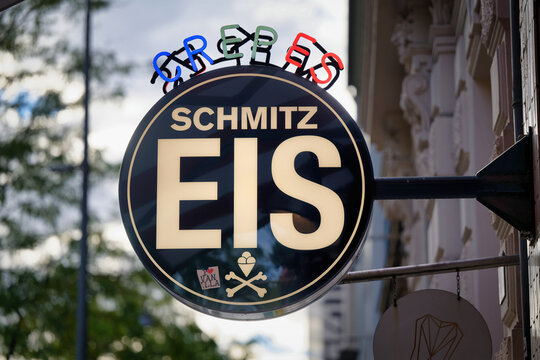 Cologne, Germany September 23 2026: Circular store sign of the popular Eis Schmitz ice cream parlor on Aachener Strasse in the Belgian Quarter in Cologne