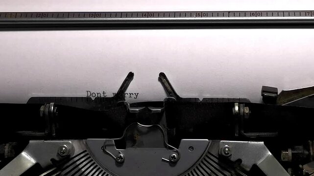 Macro Shot of Vintage Typewriter Typing Dont Worry Beer Happy