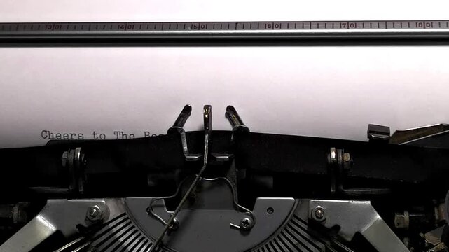 Macro Shot of Vintage Typewriter Typing Cheers to The Best Time of The Year