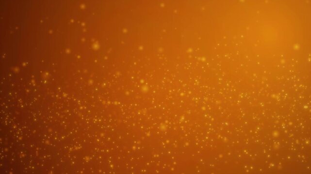 Warm orange glowing particles with soft bokeh and luminous atmospheric light leak effect. Golden light particles with warm diffuse glow and radiant bokeh