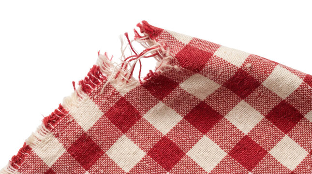 Torn corner of red and white checkered gingham fabric with frayed threads on white background