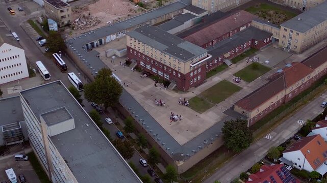 Berlin Hohenschoenhausen Memorial, a former Stasi prison, representing political persecution and communist dictatorship. Magic aerial view drone panorama shot from above