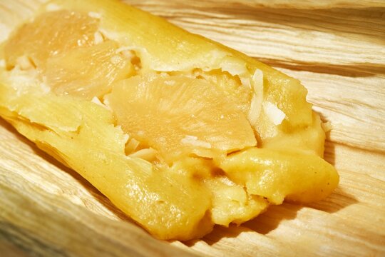 An unwrapped pineapple tamale