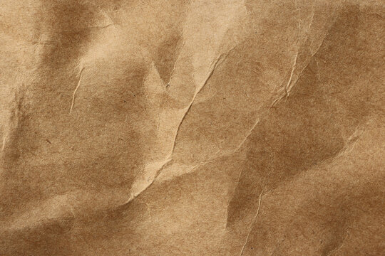 Blank brown crumpled paper texture background, old page for craft design.
