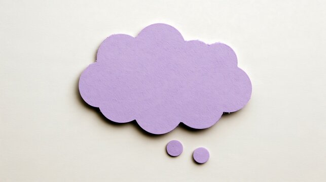 Purple thought bubble paper cutout on light neutral background