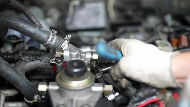 Close-Up View of Engine Valve Train Components with Timing Chain in Auto Workshop