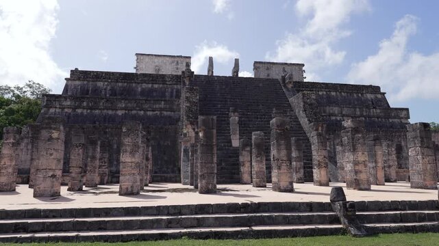 Front view of Chichen Itza ruins at sunny day, sacred mayan temple, UNESCO World Heritage,Yucatan, Mexico.