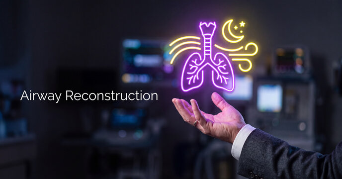 Glowing medical hologram of human lungs hovering above a professional hand inside a dark hospital room setting