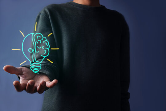 Man Open Palm Showing Lightbulb Brain Icon Illustrating Strategic Business Solutions