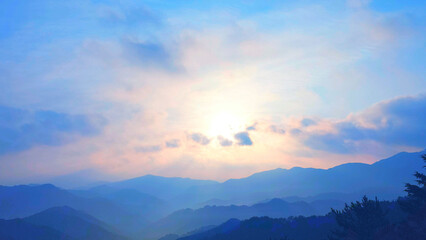 Fototapeta premium 雲間から光が差し込む山並みと夕空の風景