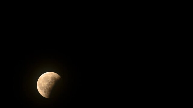 Moon rising during a partial eclipse