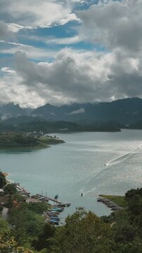 Panoramic view of Cheow Lan Lake, limestone mountains, and boats.