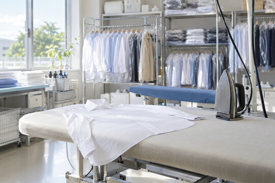Shirt on a pressing table in a small commercial laundry
