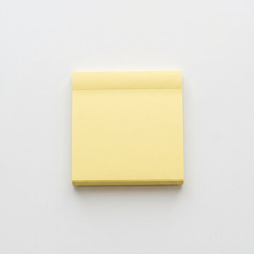 Yellow sticky note pad isolated on white background flat lay top view square stationary for office school memo note