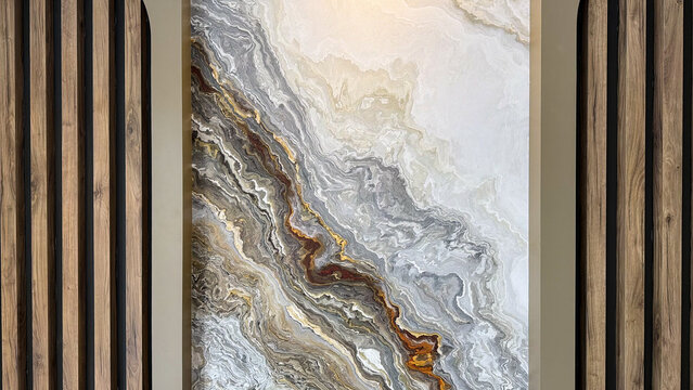 Abstract marble style wall art with flowing gray, beige, brown and gold patterns framed by decorative wooden slats in a modern interior.