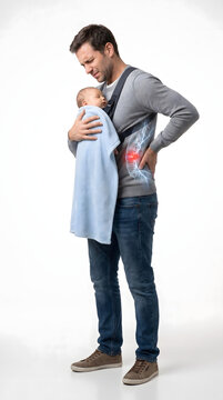 Father holding baby son while experiencing herniated disc pain