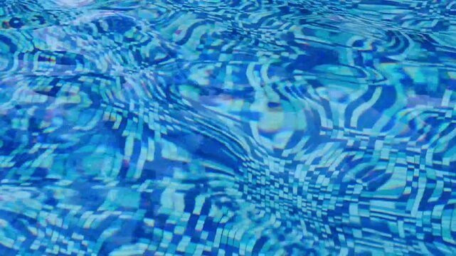 Blue swimming pool water with gentle ripples and tile pattern reflection.
