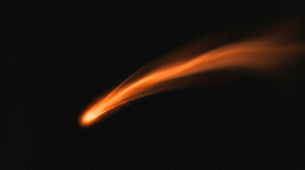 Abstract glowing orange comet or meteor trail moving through dark space © Hridoy