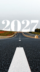 Road with the year 2027 visible on the horizon, stretching toward the distant landscape in the early hours of morning © fotofabrika