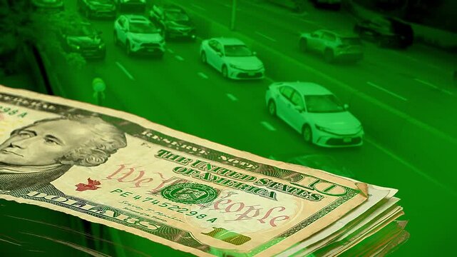 Green-toned double exposure of growing US dollar banknotes stack over busy highway traffic. Conceptual metaphor for capital growth, profitable transport, rising income, and prosperity.