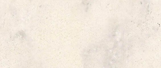 Fototapeta premium Beige granite texture with fine speckled grains and soft grey patches creates a subtle minimal background for interior design