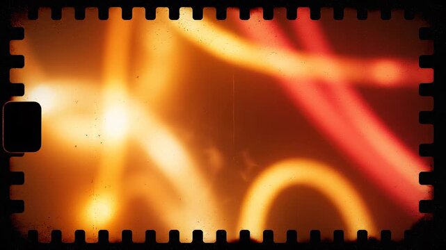 Abstract warm light streaks with film grain and perforation moving across a dark background during a cinematic sequence