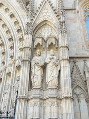 Naklejka premium Gothic Facade and Statues of Barcelona Cathedral in Spain