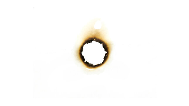 Dark brown scorched paper hole, circular charred edge with fire damage texture, burnt hole in white sheet for artistic effect, isolated on transparent background