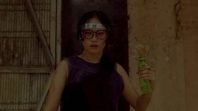 Confident Young Woman in Industrial Setting