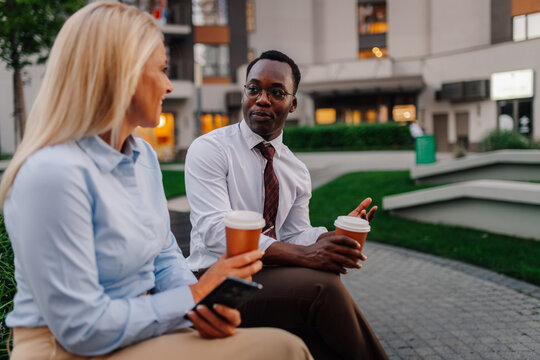 Business people having coffee break discussing work
