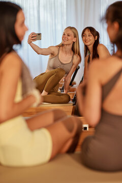 Women taking selfie during pilates fitness class