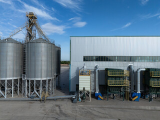 Large industrial metal silos and factory building exterior © zhu difeng