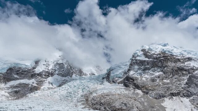 Shutterstock Description

Khumbu Icefall in the Everest region of Nepal, with clouds passing over the dramatic glacier and surrounding Himalayan mountains in a cinematic timelapse.
