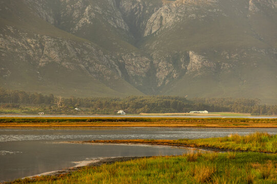 pastel sunset over placid lagoon and Klein Mountain , Stanford, South Africa