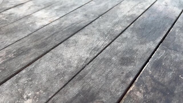 Aged grey timber decking floor surface with natural woodgrain