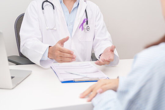 Doctor and patient having a medical consultation for purple ribbon for concept of Violence, Pancreatic, Esophageal, Testicular cancer, Alzheimer, Epilepsy, Lupus and Fibromyalgia. Awareness month