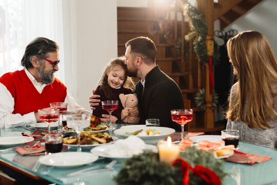 Family celebrating christmas dinner with love and joy