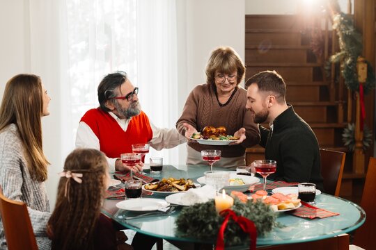 Family enjoying christmas dinner together at home