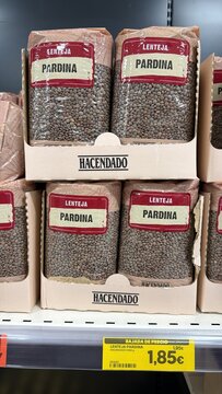 Mallorca, spain, septiembre 18, 2026 bags of hacendado pardina lentils on supermarket shelf with discounted price tag, grocery shopping and budget friendly staple