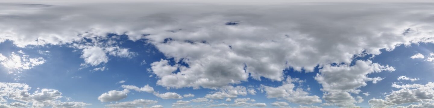 360 hdri blue sky with beautiful clouds with halo like a seamless panorama view with zenith for use in 3d graphics or game development as sky dome or edit drone shot