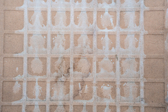 Weathered Beige Concrete Tile Grid Texture with Faded White Markings, Worn Square Pavement Pattern Background High-Resolution Neutral Stone Pattern for Construction, Design, Renovation Background Use