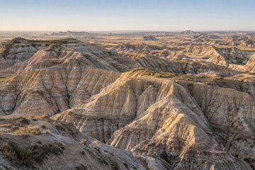 Fototapeta premium Eroded clay badlands with branching gullies in morning light