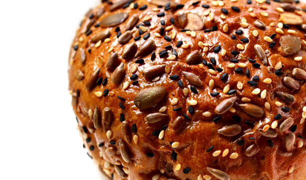 Healthy multigrain bread bun topped with mixed seeds and grains
