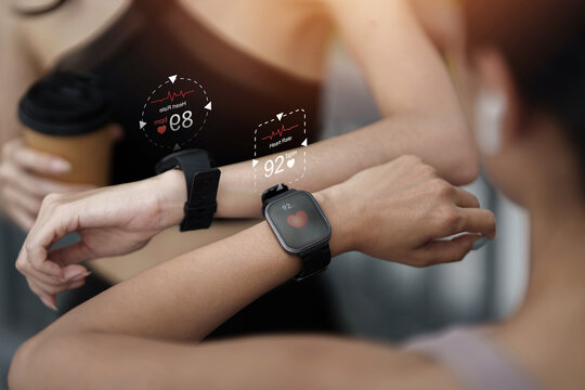 Smartwatch displaying heart rate holographic interface for fitness tracking