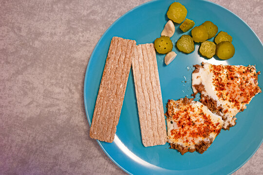 Pair of Fried Eggs and Fresh Vegetables On plate On Stony Grey Background As  Healthy Eating Concept. Top view.