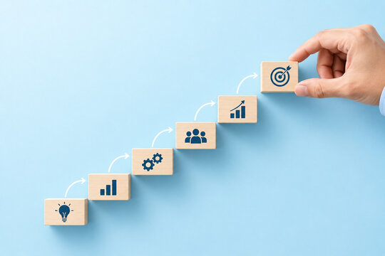 Business strategy goal growth success planning target progress teamwork chart hand placing wooden block blue background with icon step, business concept for improvement, achievement, productivity