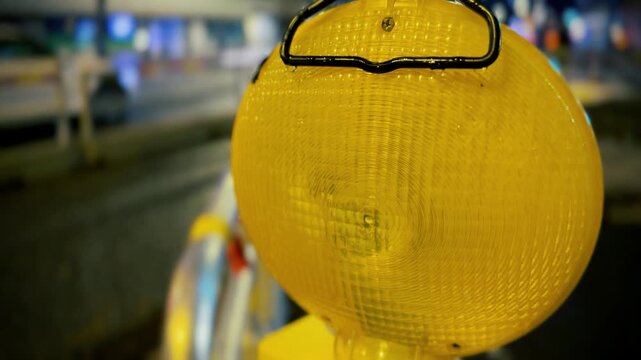 Yellow Construction Warning Light Glowing at Night