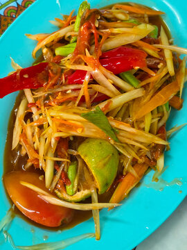 Spicy papaya with black crab Thailand called farmer crab and fresh shrimp that is famous of Thailand Street food.	
