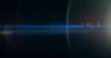 Blue anamorphic lens flare overlay featuring cinematic horizontal light streaks, soft optical reflections and subtle glow on a black background. Premium VFX element for compositing and film editing. © Jag_cz